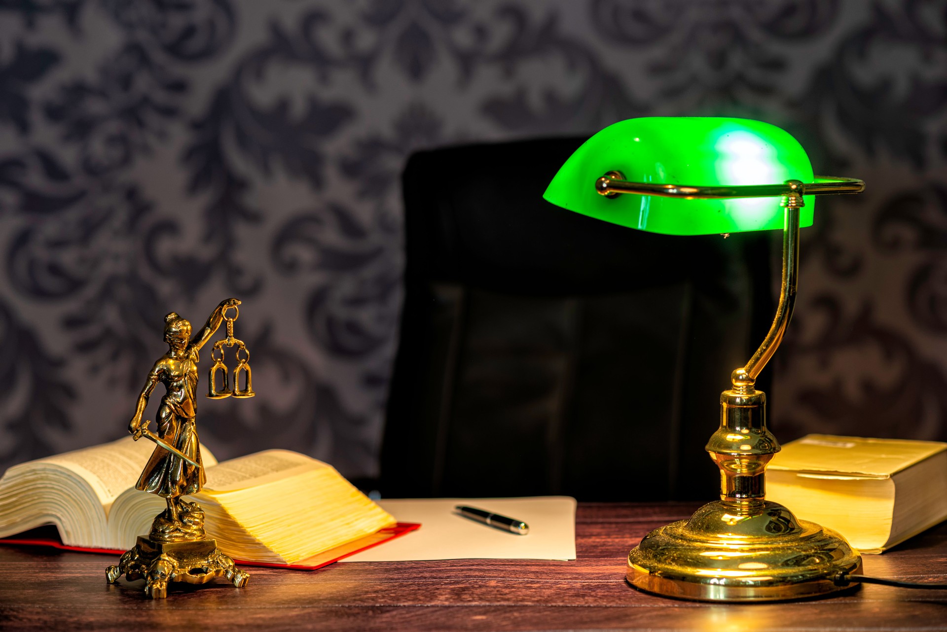 office of a lawyer with statue of Lady Justice, goddess Justitia, on the desk